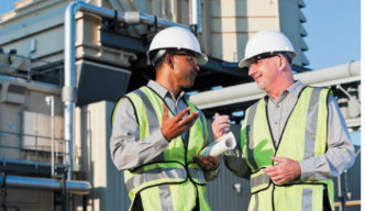 workers in safety vests talking