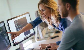 people looking at a computer screen